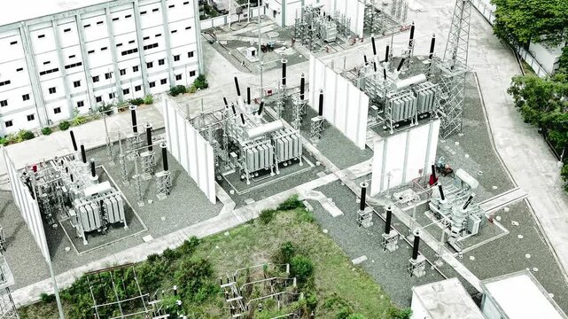 Aerial view of electric substation with high voltage transformers and power grid infrastructure in Chennai, Tamil Nadu, India.