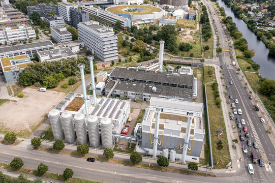 Aerial view of BTB Heizkraftwerk Adlershof power plant with industrial chimneys, modern facilities, and surrounding urban infrastructure in Berlin, Berlin, Germany.
