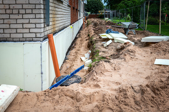 Apartment Building Renovation with Foundation Waterproofing and Thermal Insulation