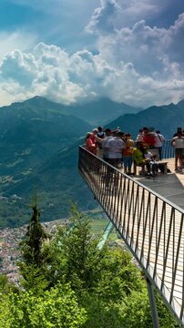 Interlaken Switzerland mountain timelapse with rushing clouds over Harder Kulm viewing platform and Swiss Alps panorama on sunny day