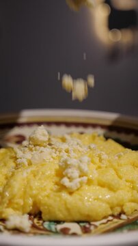 Сlose Up of Traditional Ukrainian Banosh with Crumbled Cheese