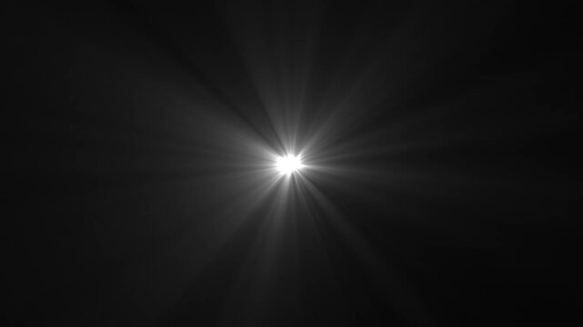Bright Optical Lens Flare and Light Rays Burst on Black Background