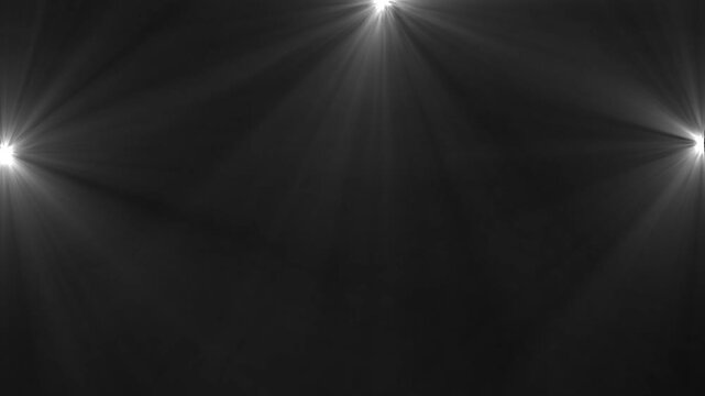 Stage Spotlights Flashing with Light Beams and Smoke Effect on Dark Background