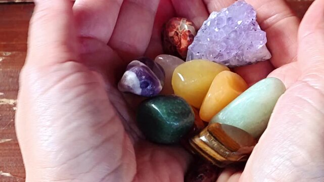 Natural minerals in hand. Semi-precious multi-colored stones, minerals close-up. Mineralogy. Collection of minerals.	