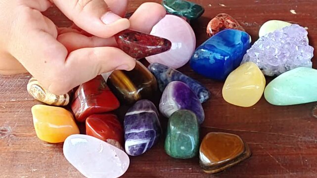 Natural minerals in hand. Semi-precious multi-colored stones, minerals close-up. Mineralogy. Collection of minerals.	