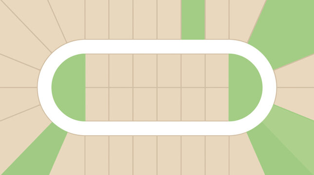 An athletic running track with a surrounding green field.