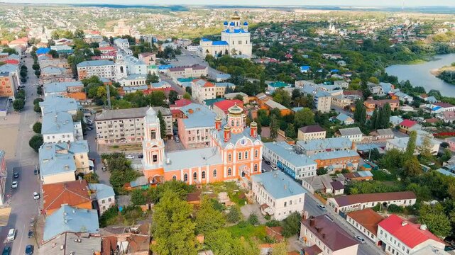 Yelets, Lipetsk region, Russia. Church of the Archangel Michael, a five-cupola Orthodox cathedral with gilded domes and salmon-pink walls, Drone footage over the historic city center. Drone footage