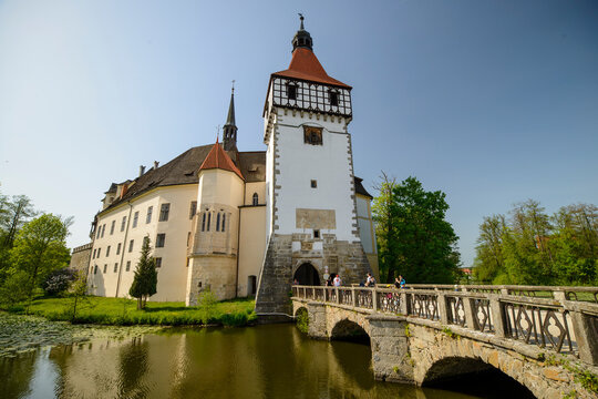 BLATNA, CZECH REPUBLIC - AUGUST 2017: Scenic view of the historic Blatna water castle surrounded by a moat during a sunny summer day.