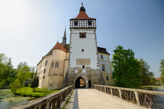 BLATNA, CZECH REPUBLIC - AUGUST 2017: Scenic view of the historic Blatna water castle surrounded by a moat during a sunny summer day.