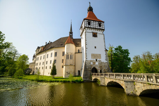 BLATNA, CZECH REPUBLIC - AUGUST 2017: Scenic view of the historic Blatna water castle surrounded by a moat during a sunny summer day.