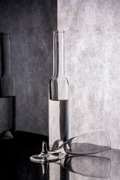 Still life with a bottle and a broken glass