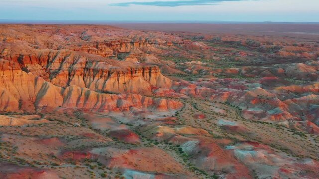 Aerial view of the colorful sedimentary rock formations of Tsagaan Suvarga, also known as the White Stupa, in the Gobi Desert, O'lziit, Dundgovi, Mongolia.