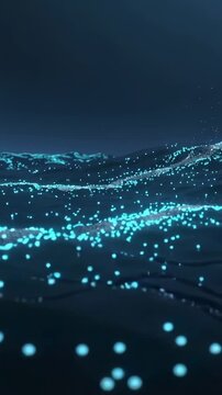 Vertical video: Moving camera low, revealing turquoise particles spraying off dark ocean waves