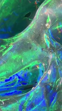 Abstract glass texture with vibrant green hues
