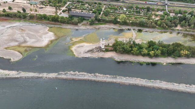 Confluence of Nahe and Rhine River at Bingen, Germany - Visible rocks and sandbars due to extraordinary low water level after a long period of drought - aerial view