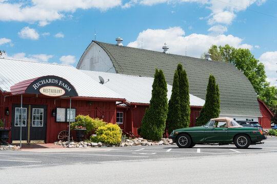 Green MGB Roadster parked outside Richards Farm Restaurant, Casey, Illinois, May 2026