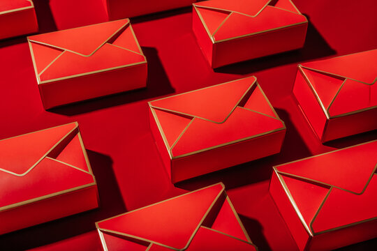 Red gift envelopes arranged on a bright festive background