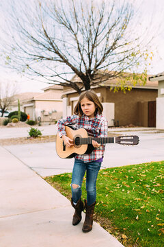Autumn Portrait of Girl Playing Guitar