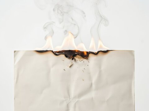 Burning paper edge with smoke isolated on white background