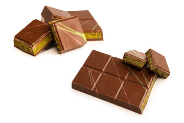 Fototapeta premium Chocolate with pistachio filling isolated on a white background. Dubai chocolate bar.