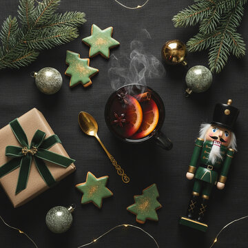 Dark Green Flat Lay of Organic Homemade Mulled Wine with Fresh Orange Slices, Star Anise and Cinnamon Sticks for Rustic Holiday Blogs