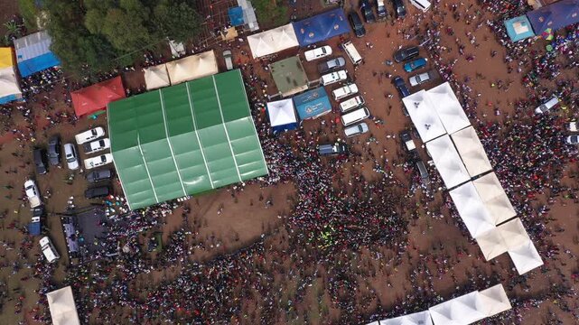 Aerial view of a large crowd gathered for the Imbalu Circumcision ceremony at the Bamasaaba Culture Centre Mutoto in Mbale, Eastern Region, Uganda.