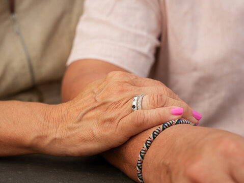 Senior couple share tenderness through a gentle arm touch