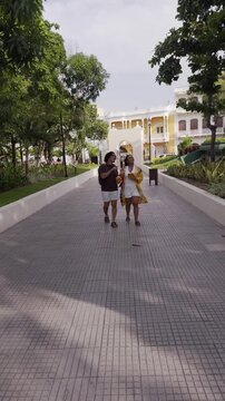 Happy couple enjoying vacation walking in a public park