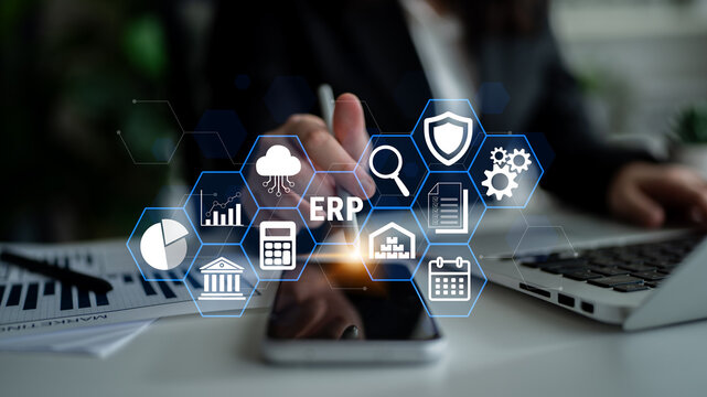 Business Professional Using Technology for ERP Implementation with Visual Data and Icons Representing Business Processes and Management Solutions Fluxor.