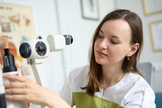 Ophthalmologist performing vision diagnostics in modern eye clinic