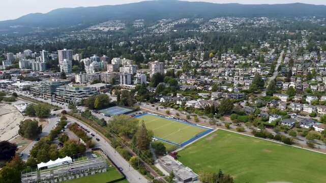 drone aerial pan of west vancouver mountains and homes