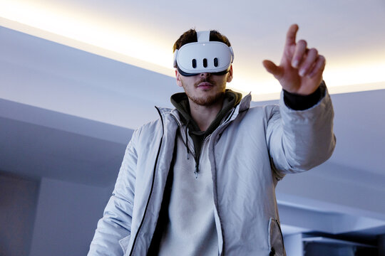 Man use virtual reality headset in modern indoor space