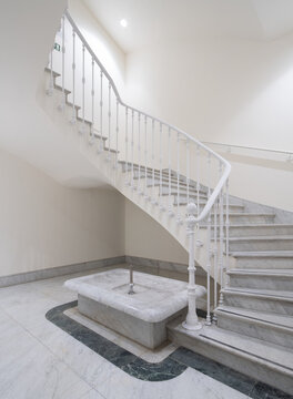 Neoclassical office staircase with marble interior and railing