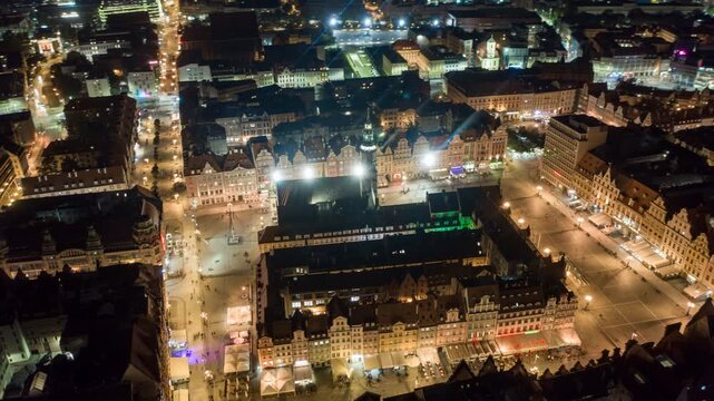Night aerial hyperlapse over Wroclaw Market Square and historic Old Town
