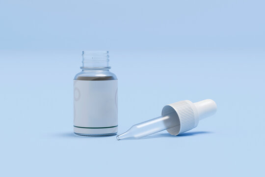 Glass dropper bottle with pipette on blue background