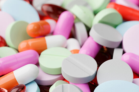 Assorted colorful pills and capsules in close-up