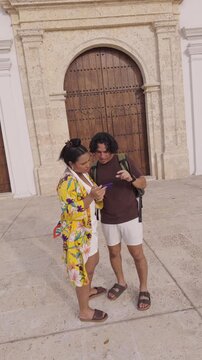 Young couple using a smartphone for directions
