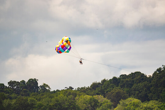 Parasailing above tropical rainforest in Costa Rica