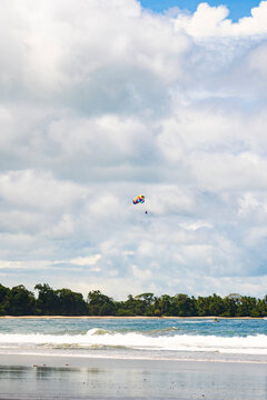 Parasailing above tropical beach and ocean in Costa Rica