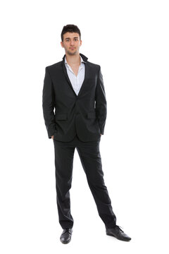 Young businessman portrait isolated on white background, looking at camera, full length