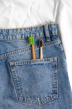 Bamboo toothbrush in denim pocket for sustainable dental care