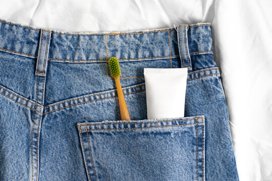 Eco-friendly dental care essentials in denim pocket