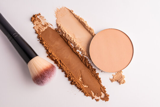 Compact powder refill with cosmetic swatch and brush