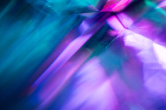 Abstract blue and purple light rays with blurred texture