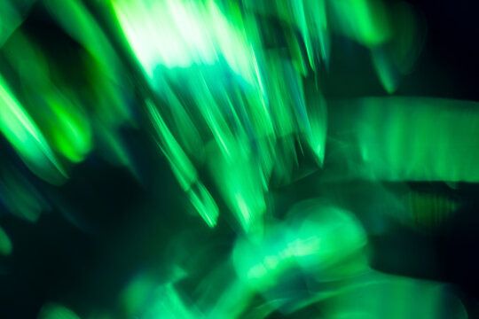 Abstract green light trails with motion blur background