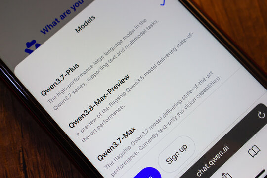 Mexico City, MEXICO - Jul 21 2026 : Close-up of a smartphone showing the model list on chat.qwen.ai, with Qwen3.7-Plus, Qwen3.8-Max-Preview and Qwen3.7-Max and a sign up button.