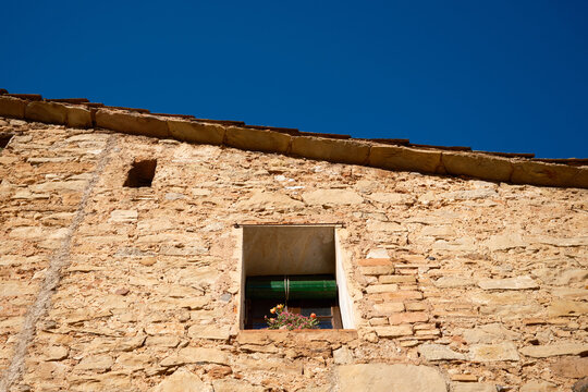 Rustic stone house facade in Mura village, Spain