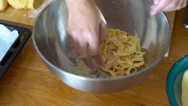 Woman doing homemade pasta indoor - Italian food and lifestyle concept	
