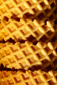 Golden waffle texture for minimalist food concept background
