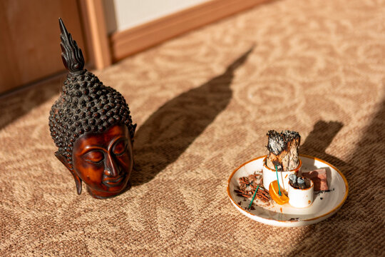 Buddha statue and incense ritual for peaceful home meditation